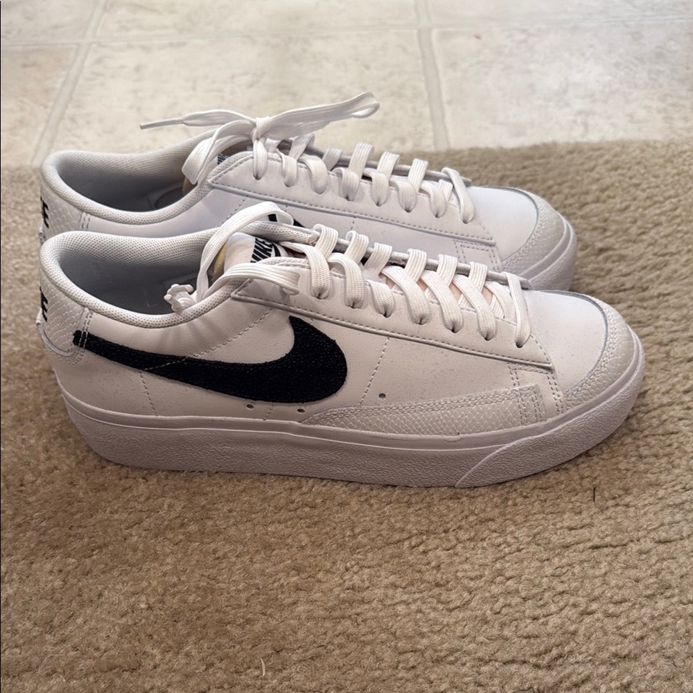 Nike White Sneakers with Black Swoosh